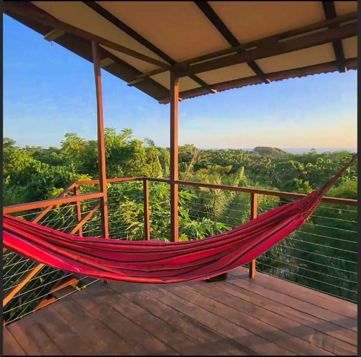 Hammock on private deck with Caribbean jungle views — off-grid luxury property Colombia
